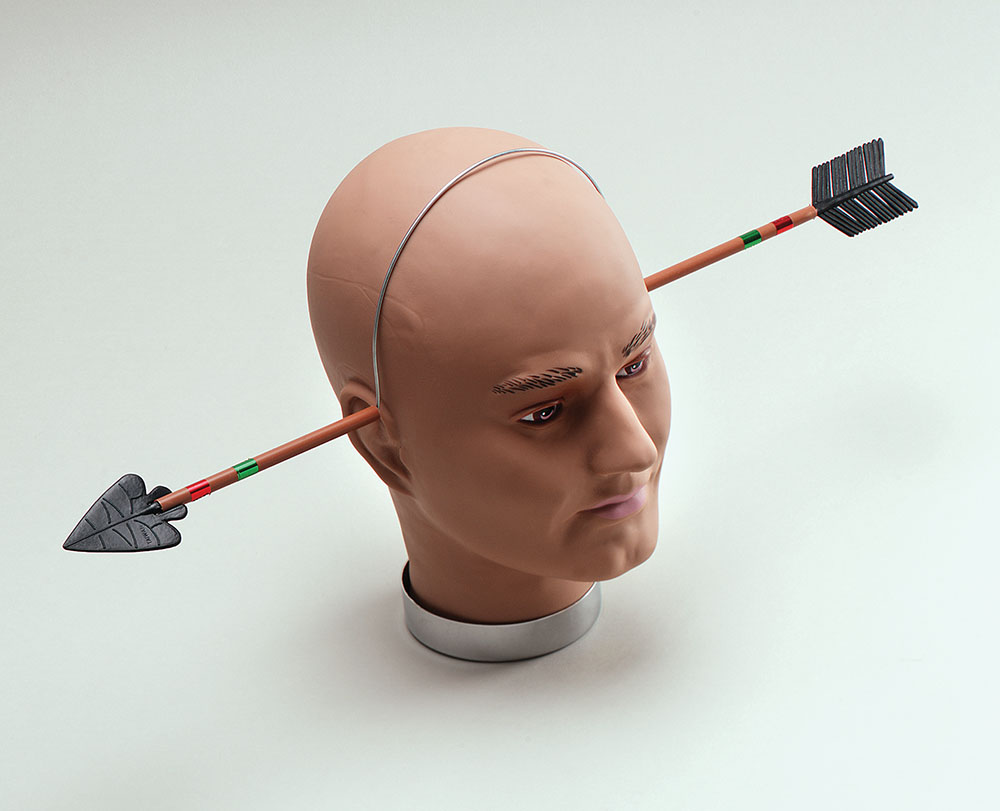 Arrow Through Head. Adult Size - Click Image to Close